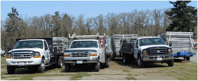 Tacoma area fence rental delivery trucks.