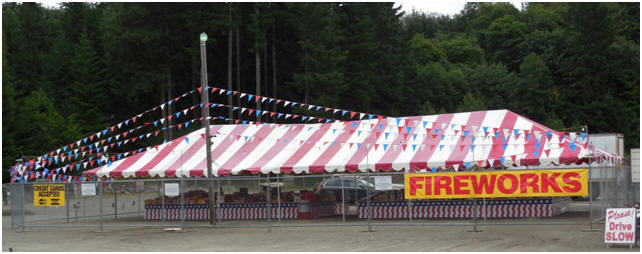 Rental fencing around a fireworks stand on the Fourth of July